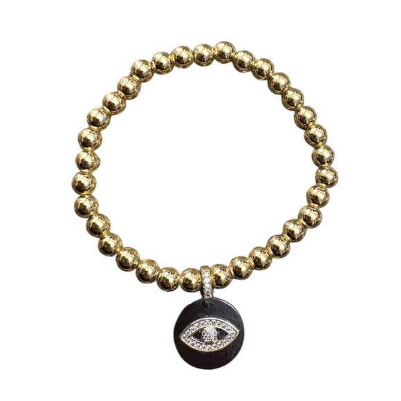 Gold tone beaded elastic bracelet with black and rhinestone evil eye pendant - Picture 4 of 4